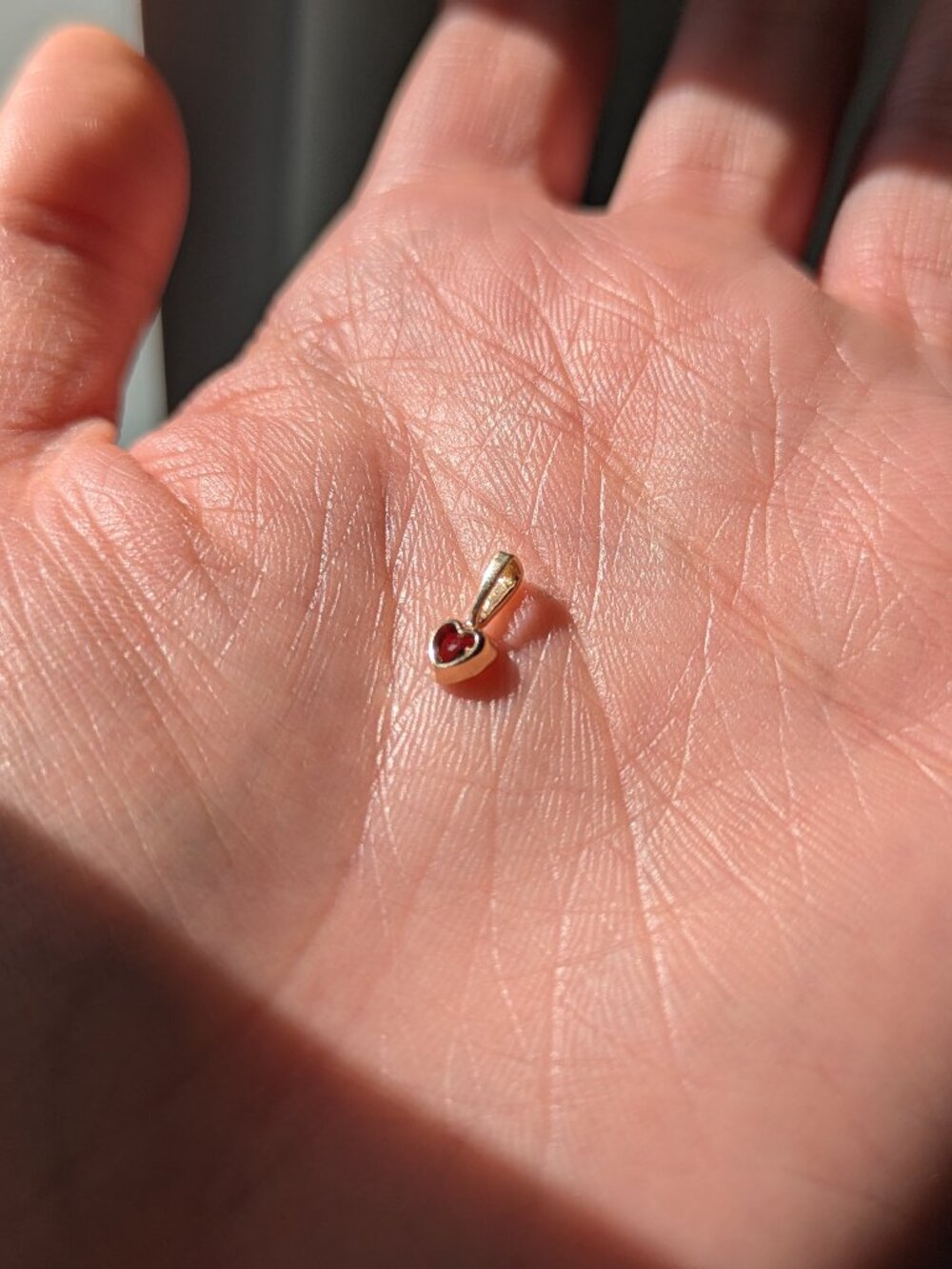 Concrete Collective garnet baby heart charm